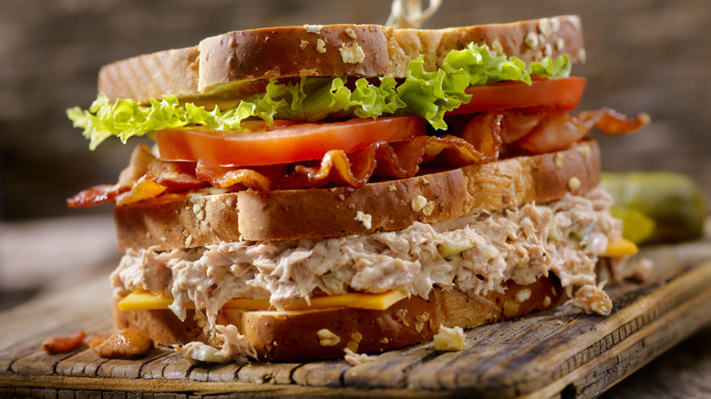 Tuna salad sandwich on a cutting board