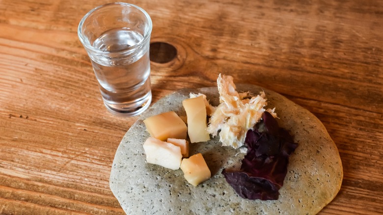 Cubes of hakarl with a shot of alcohol