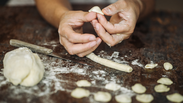 Shaping orecchiette with butter knife and thumb