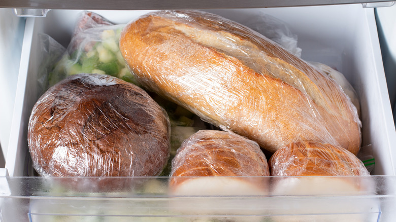 Four loaves of bread in freezer
