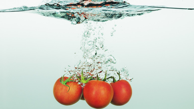Tomatoes submerged in water