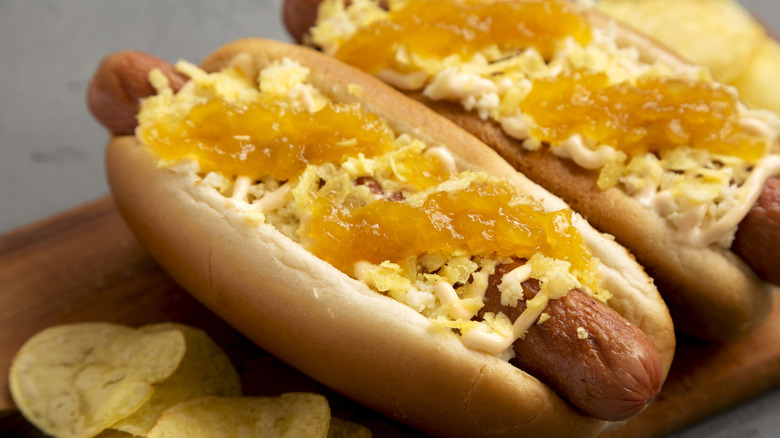 Colombian-style hot dogs with pineapple sauce and shoestring potatoes
