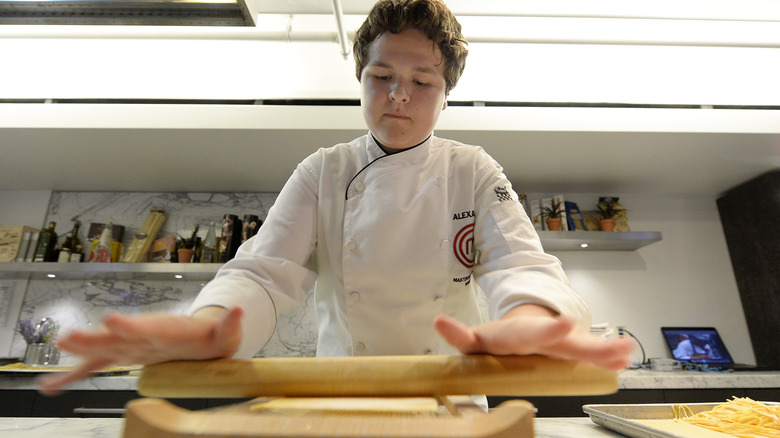 A chef uses a chitarra