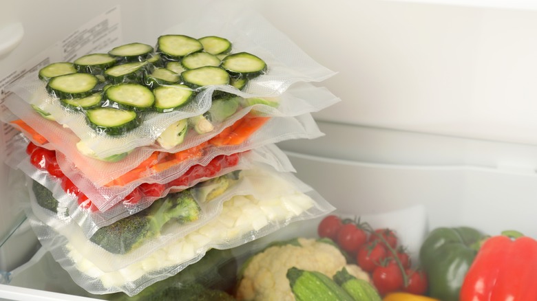 bags of produce vacuum sealed and in a fridge