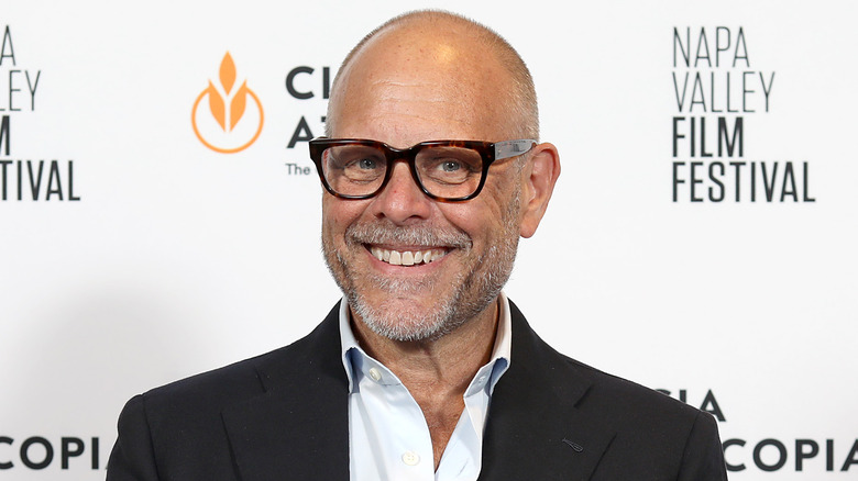 Headshot of Food Network star Alton Brown smiling