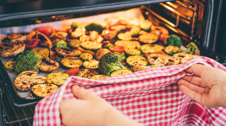 A tray of roasted vegetables in the oven