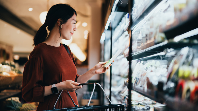 Woman looking at items in to-go section