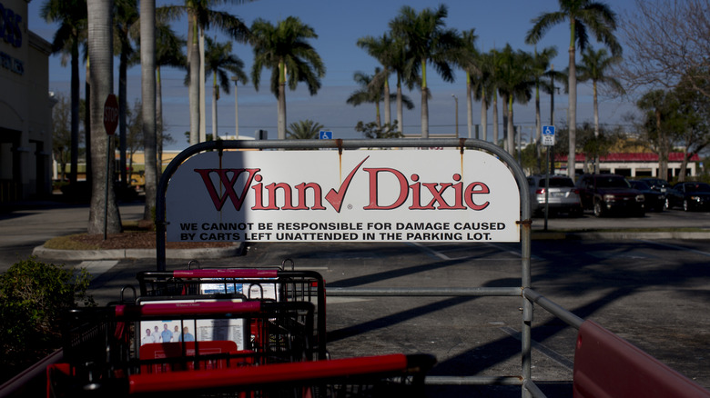 a shopping cart enclosure outside a Winn Dixie store