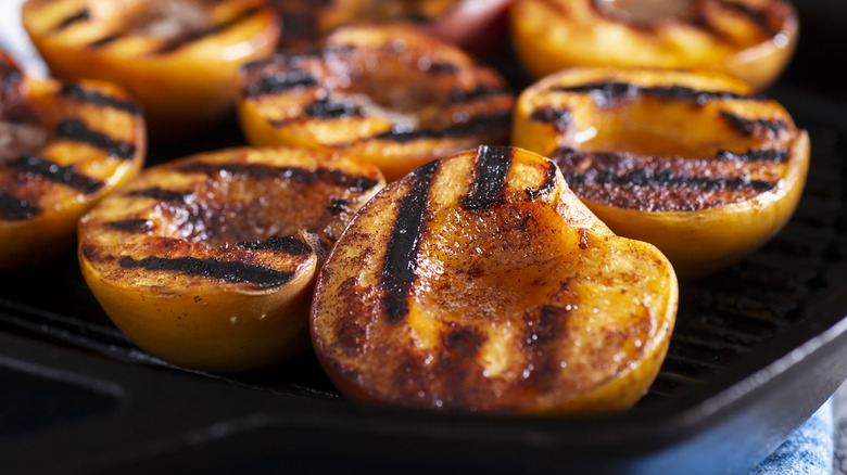 Grilled peach halves in grill pan