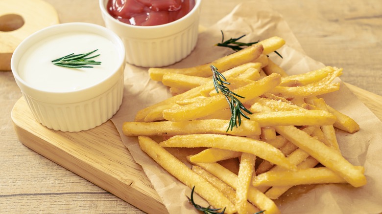 french fries on wooden board