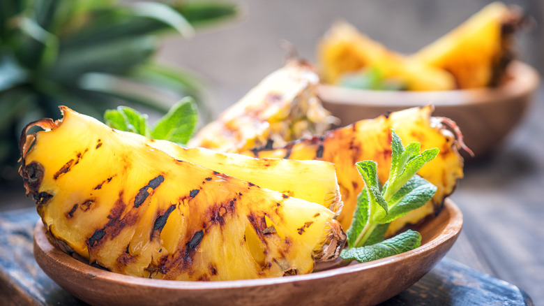 Bowl of grilled pineapple wedges