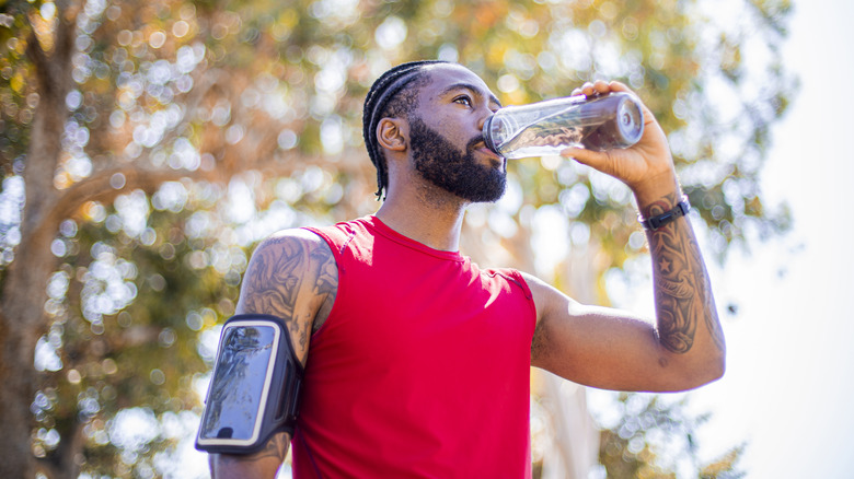 Athlete drinking bottled water