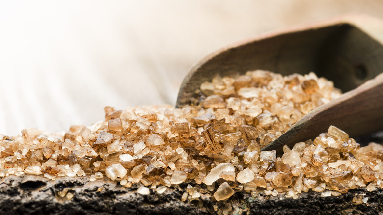 Smoked salt flakes with a wooden scoop