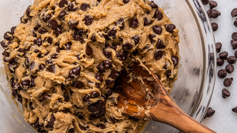 Chocolate chip cookie dough in a glass bowl