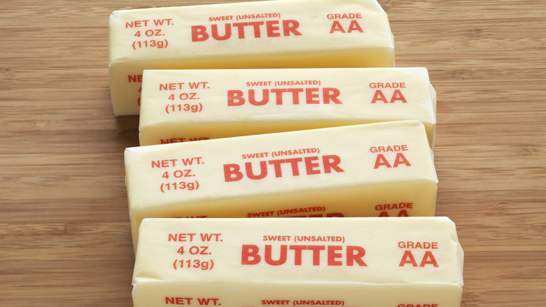 Four wrapped sticks of unsalted butter