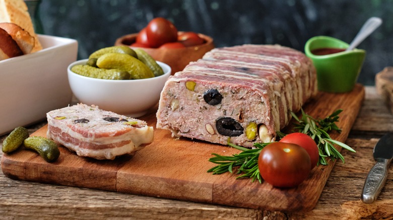 Sliced terrine with olives and pistachios