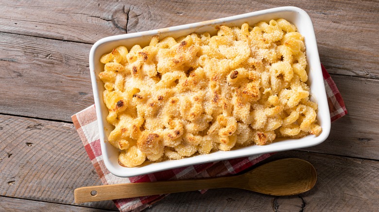 Casserole dish of mac and cheese with breadcrumb topping