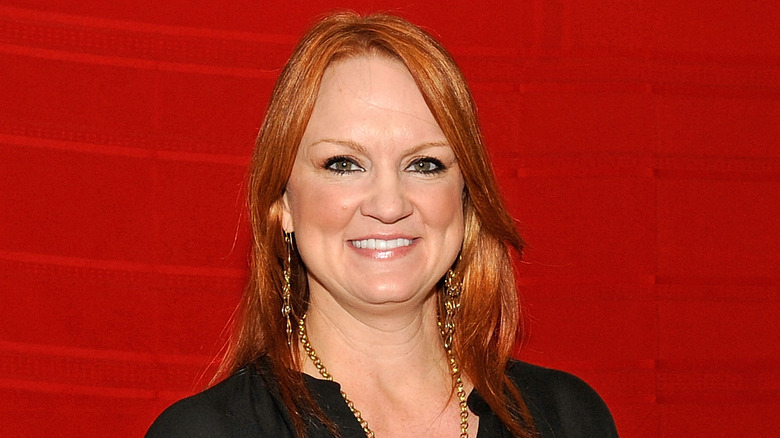 Ree Drummond smiling against red background