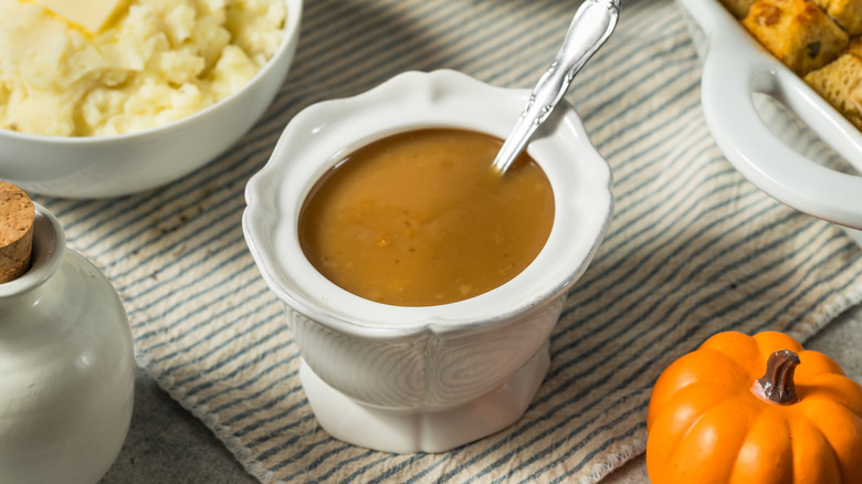 Bowl of brown gravy on Thanksgiving table