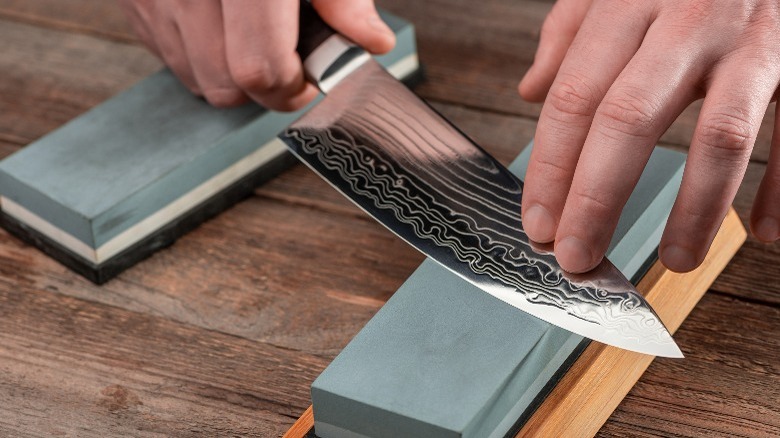 Sharpening a knife with whetstone