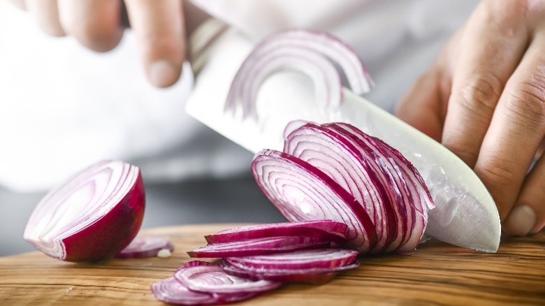 Chopping red onion