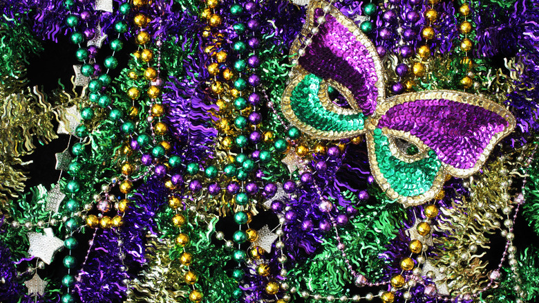 Mardi Gras beads and glitter