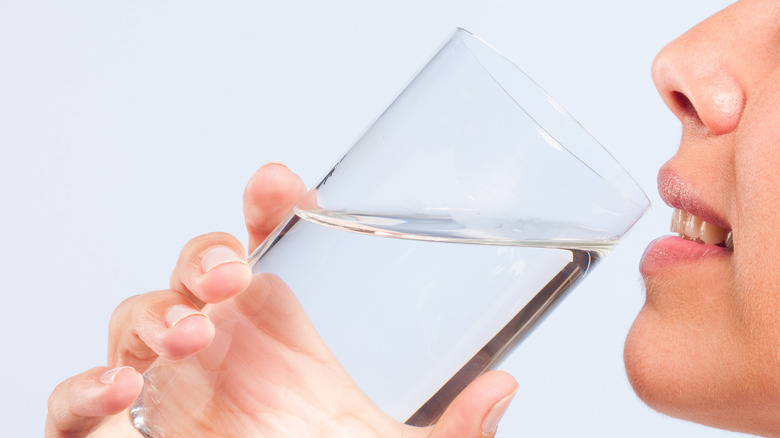 Woman drinking water from glass