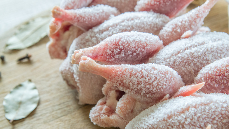 Frozen poultry with ice crystals