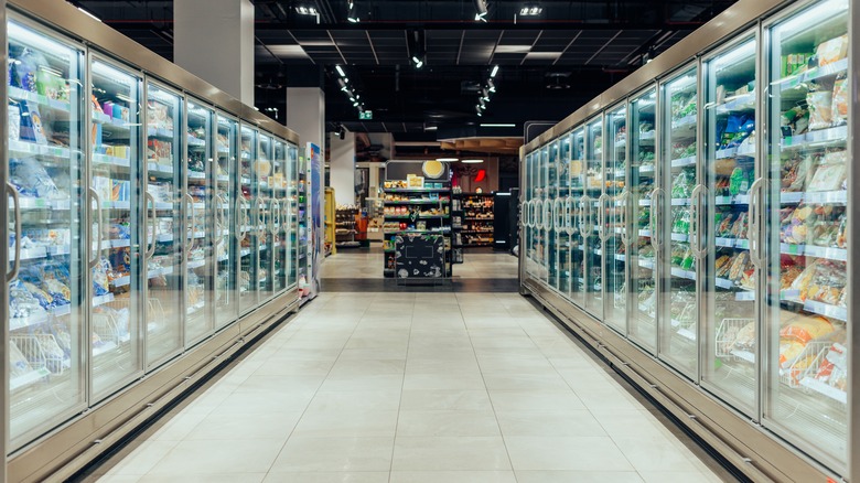 Grocery store freezer aisle with display cabinets