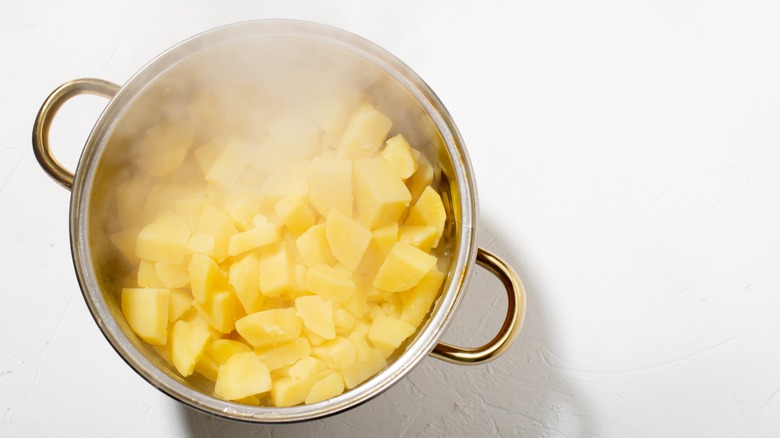 parboiled potatoes in a pot