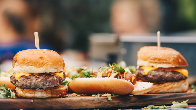 Juicy grilled burgers on a cutting board