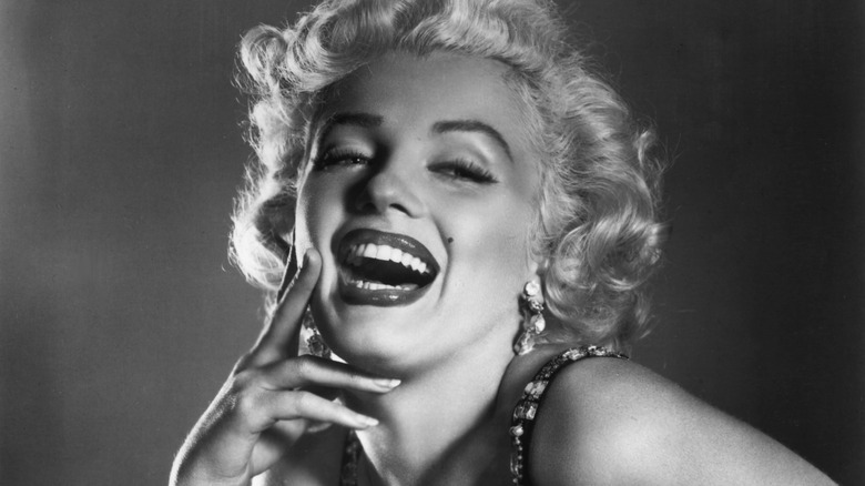 Marilyn Monroe laughing for the camera.