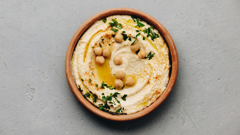 Hummus in brown bowl
