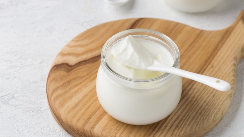 Natural yogurt in glass bowl
