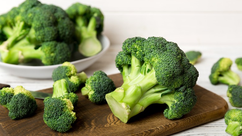 Broccoli on wooden cutting board