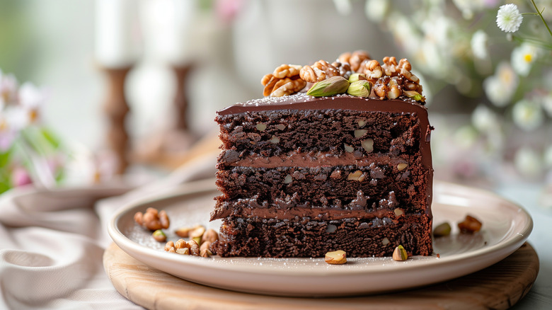 A piece of moist chocolate cake with pistachios