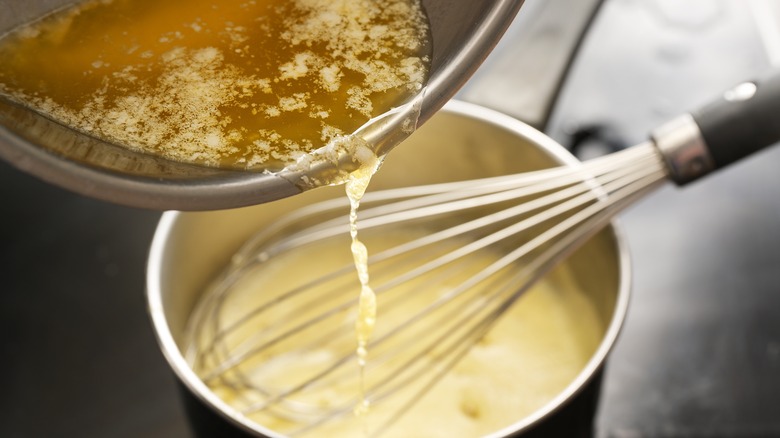 butter being poured into hollandaise