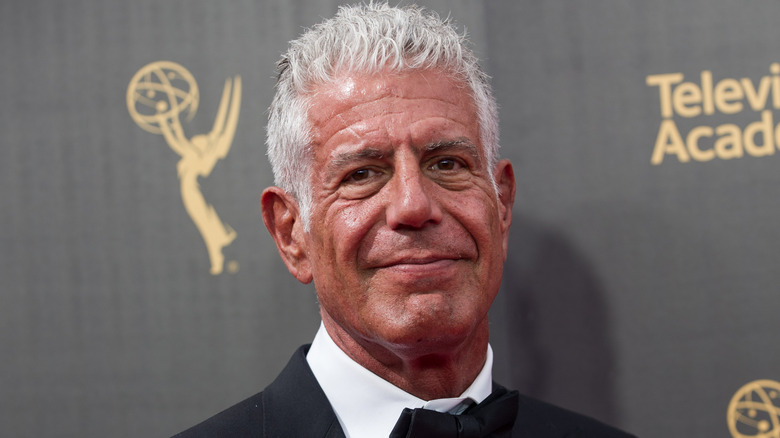 Anthony Bourdain smiling on 2016 Emmy's red carpet