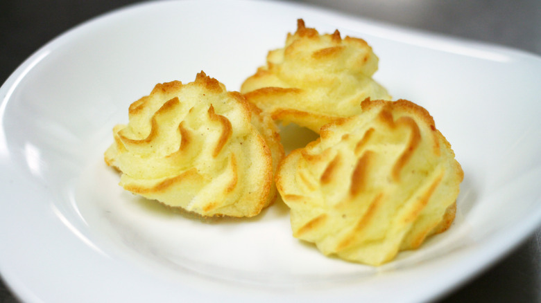 Pommes Duchesse on a white plate