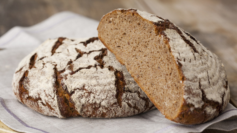 Round bread loaves on linen cloth