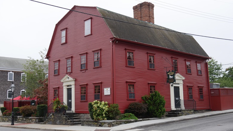 Exterior of White Horse Tavern red colonial building with gambrel roof
