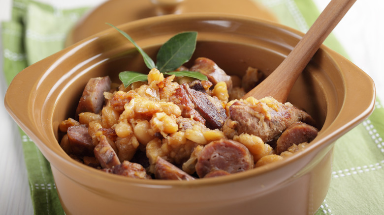 Cassoulet with beans and sausage in a brown dish