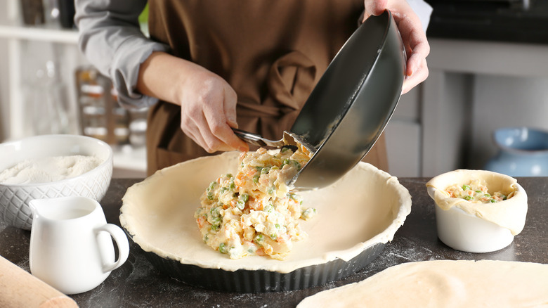 Woman making chicken pot pie