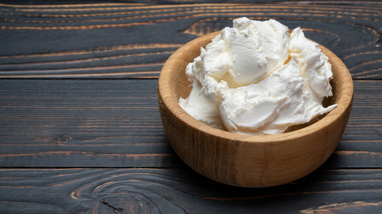 Mascarpone cheese in a small wooden bowl