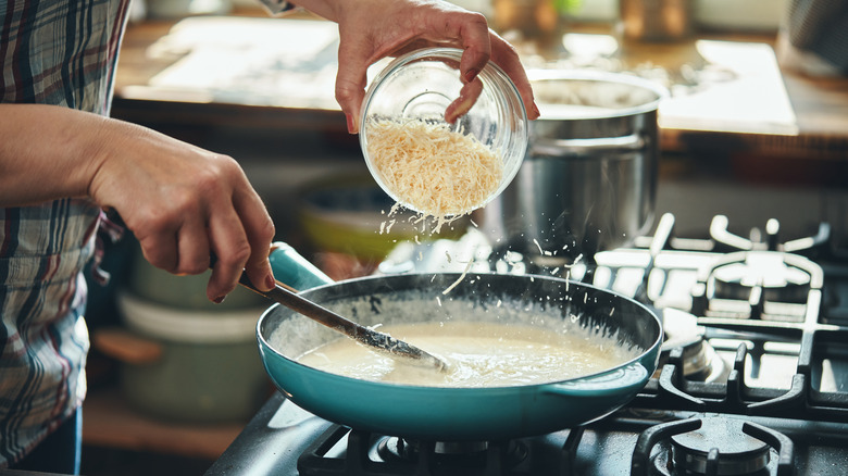 Cheese stirred into sauce pan