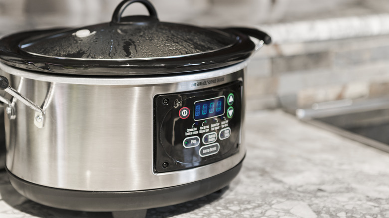 A slow cooker on a kitchen counter