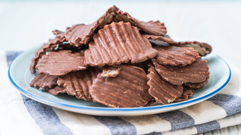 Chocolate-covered potato chips on a plate