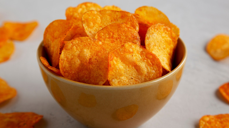 A bowl of homemade, paprika-flavored potato chips