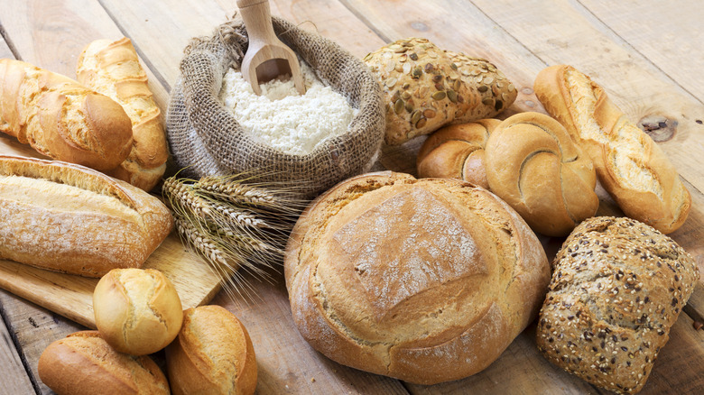 A sack of flour next to breads