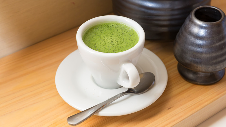 Matcha in white espresso cup